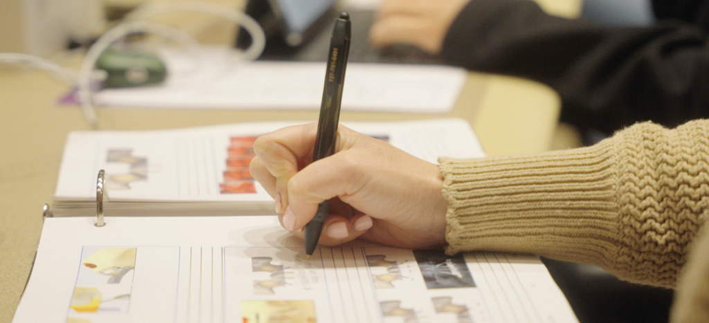 Image of a hand taking notes